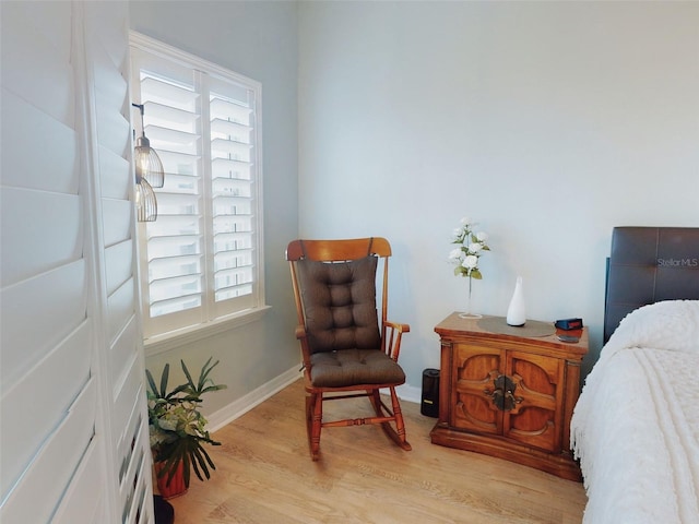 5300 S Atlantic Ave Unit 3-504, New Smyrna Beach, FL 32169 - living area featuring baseboards and light wood-style flooring
