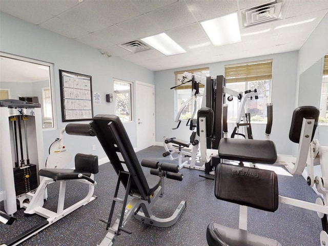 5300 S Atlantic Ave Unit 3-504, New Smyrna Beach, FL 32169 - gym with visible vents, baseboards, a drop ceiling, and a wealth of natural light