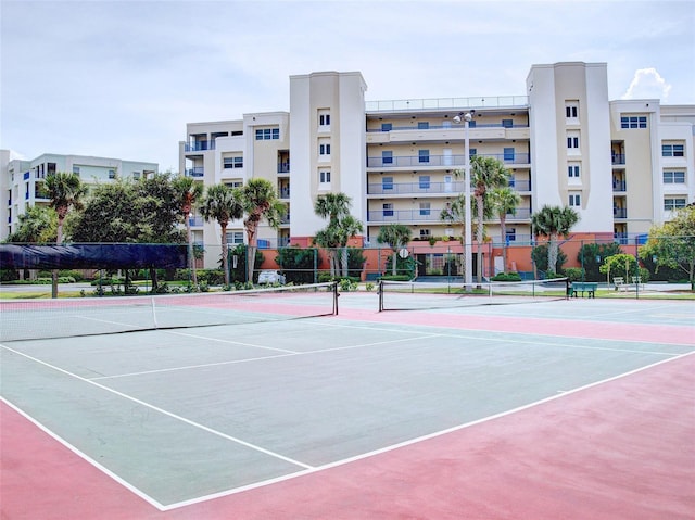 5300 S Atlantic Ave Unit 3-504, New Smyrna Beach, FL 32169 - view of tennis court with fence and community basketball court