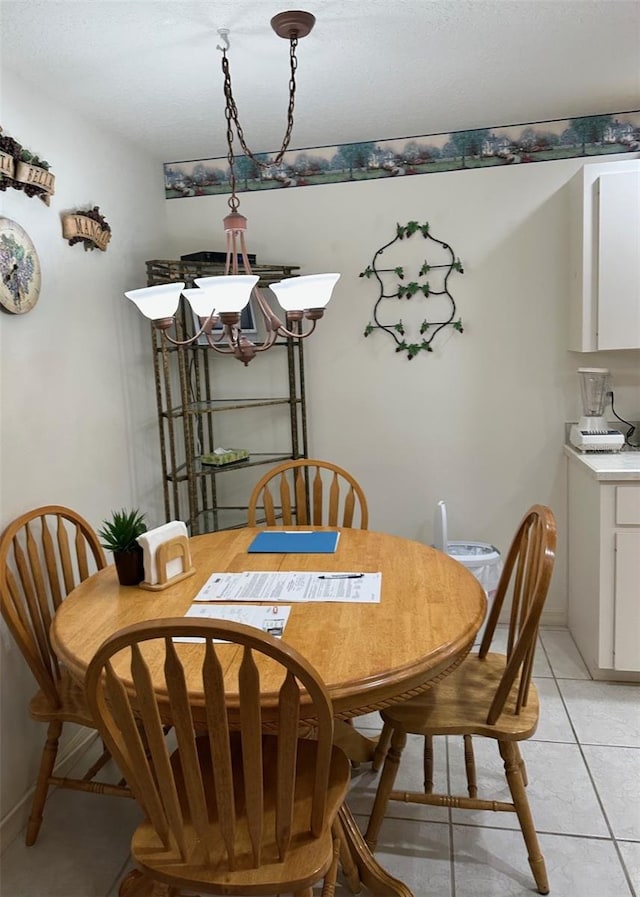 dining room featuring light tile patterned floors and baseboards