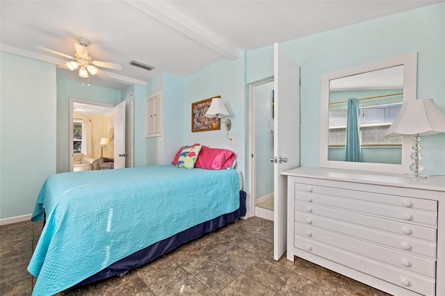 bedroom featuring beam ceiling and multiple windows