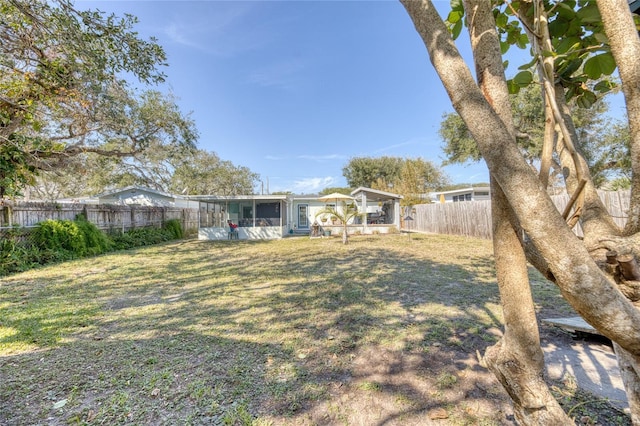 view of yard featuring a sunroom