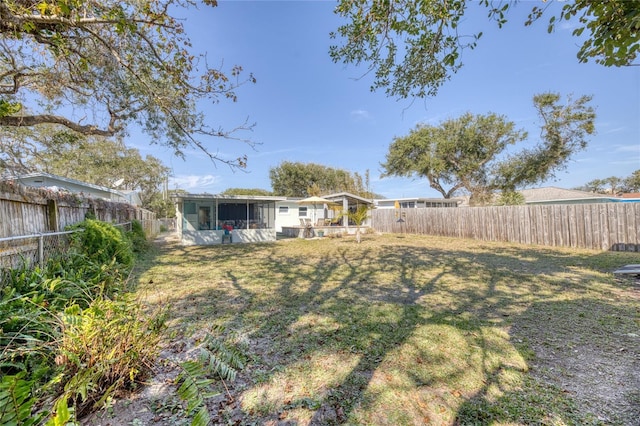 view of yard with a sunroom