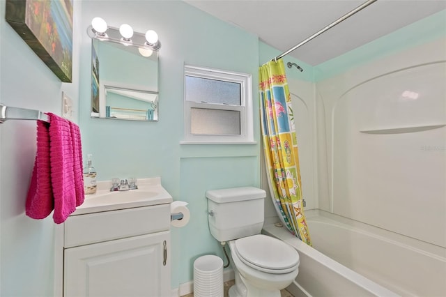 full bathroom with shower / tub combo with curtain, vanity, and toilet