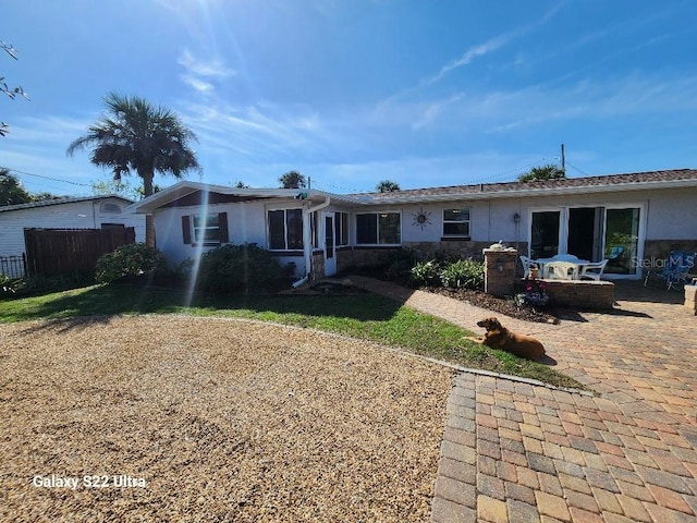 back of house with a patio area