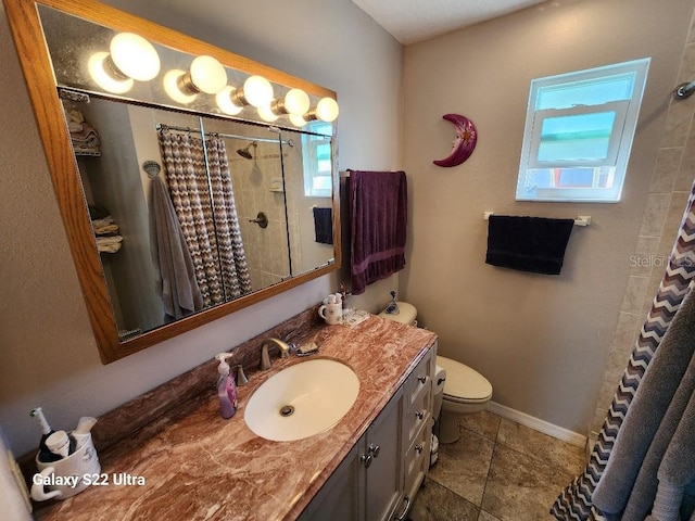 bathroom featuring vanity, tile patterned flooring, curtained shower, and toilet