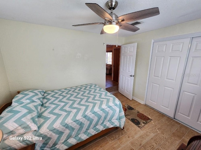 bedroom with hardwood / wood-style flooring and ceiling fan