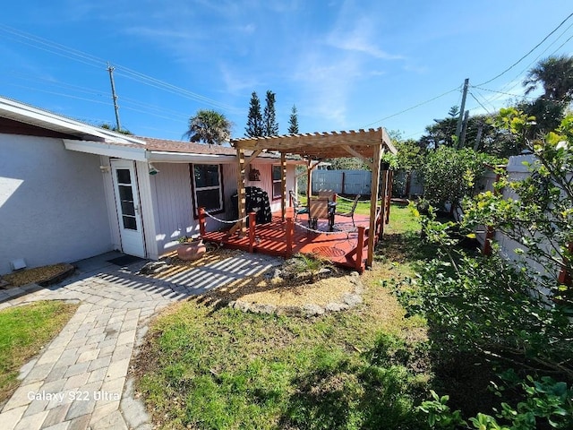 view of yard featuring a pergola and a deck