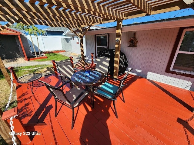 wooden terrace with a pergola