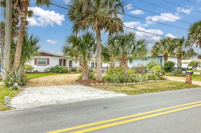 view of front of home featuring fence