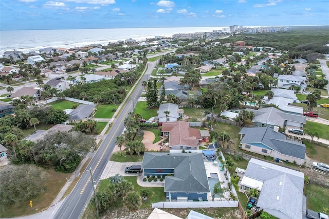 birds eye view of property featuring a water view and a residential view