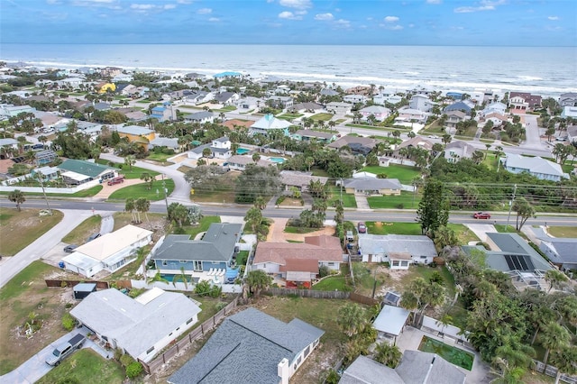 birds eye view of property with a residential view and a water view