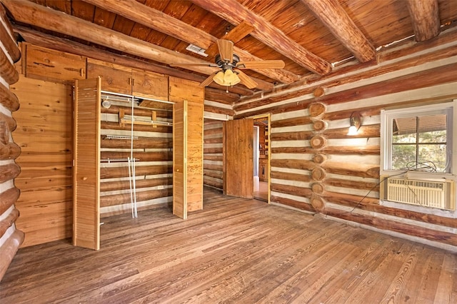 interior space with wood-type flooring, cooling unit, log walls, wood ceiling, and beam ceiling