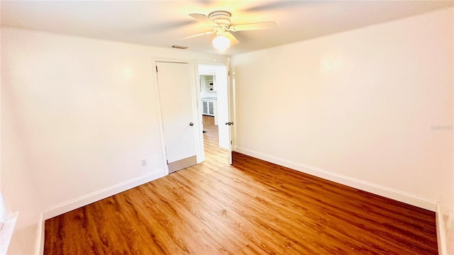 unfurnished room featuring ceiling fan and light hardwood / wood-style floors