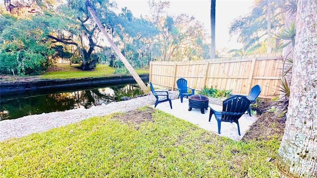 view of yard with an outdoor fire pit