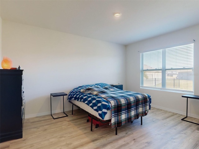 bedroom with light hardwood / wood-style flooring