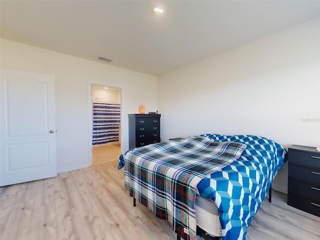 bedroom featuring light hardwood / wood-style floors