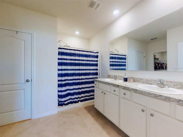 bathroom featuring vanity, tile patterned floors, and a shower with curtain