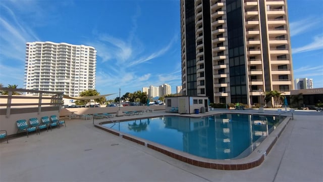 view of swimming pool with a patio area