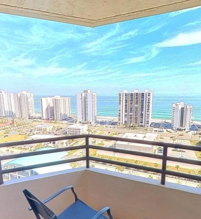 balcony featuring a water view