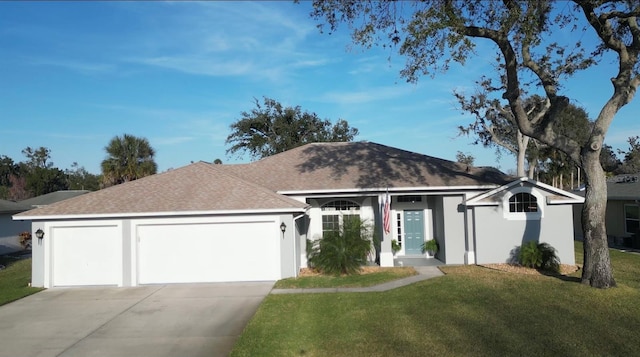 ranch-style house featuring a garage and a front yard