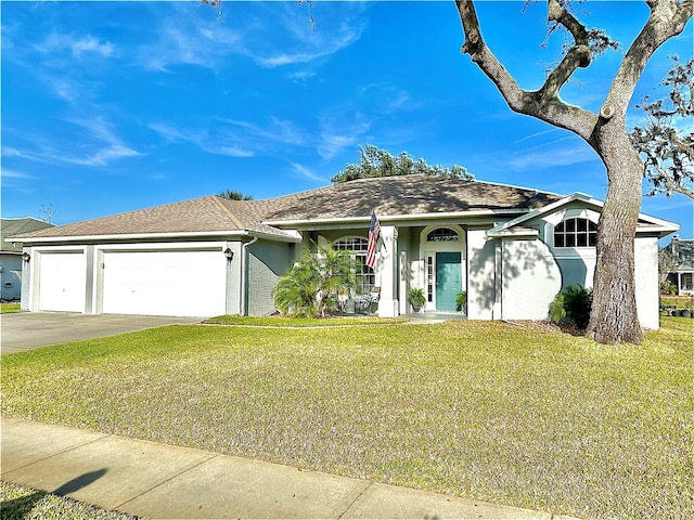 ranch-style home featuring a garage and a front lawn