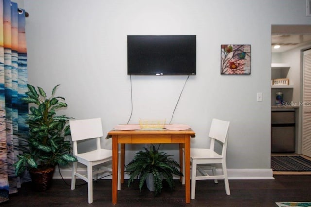 dining space featuring dark hardwood / wood-style flooring