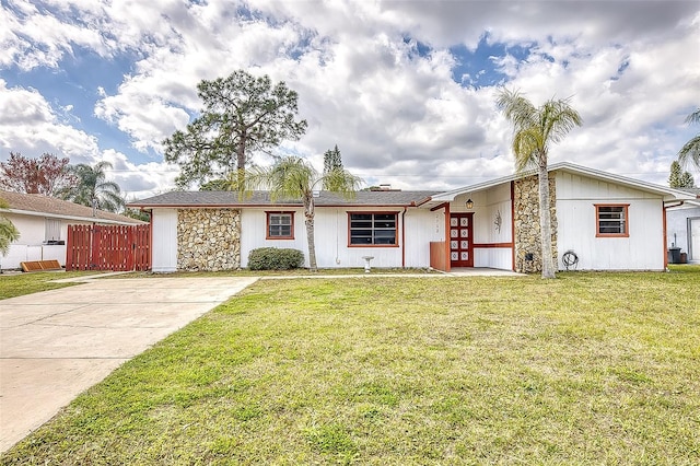 view of front of home with french doors and a front lawn