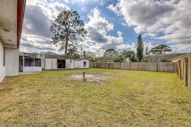 view of yard featuring a storage unit