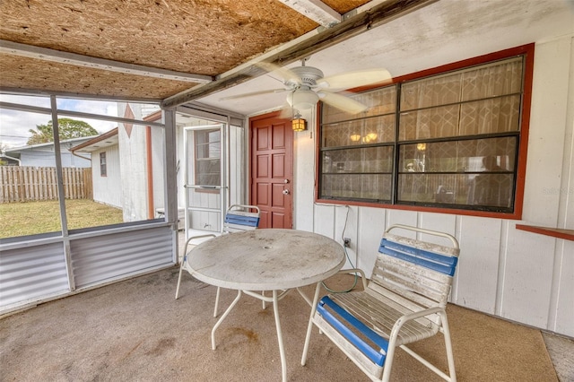 sunroom / solarium with ceiling fan