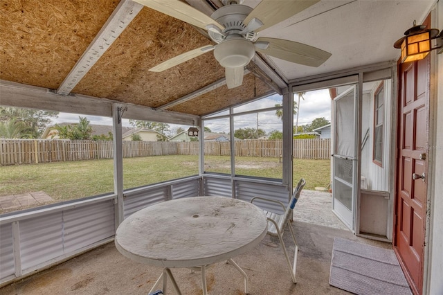 sunroom / solarium featuring ceiling fan