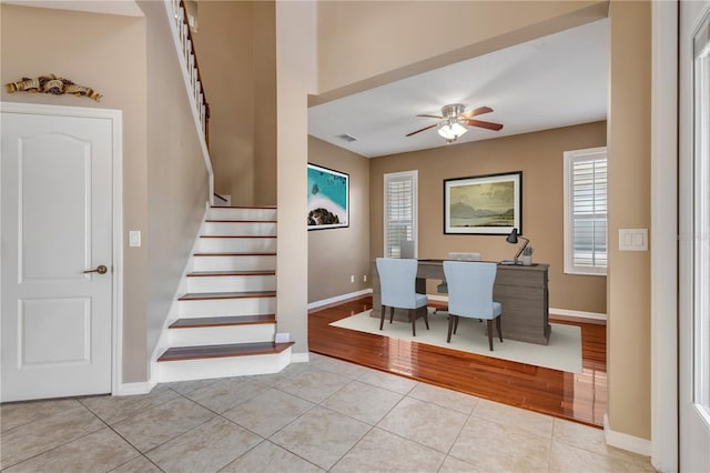 interior space featuring ceiling fan