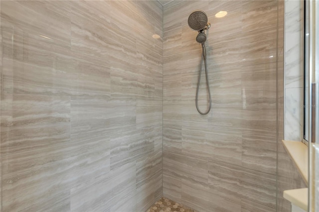 bathroom with tiled shower