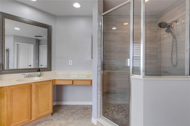 bathroom featuring vanity, tile patterned floors, and walk in shower