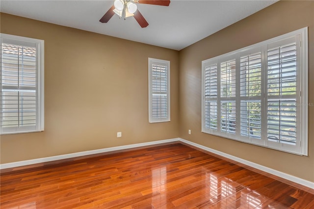 unfurnished room featuring ceiling fan and light wood-type flooring