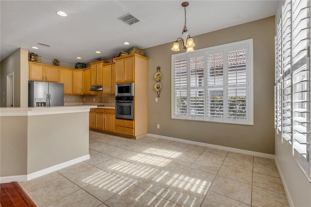 kitchen with light brown cabinetry, an inviting chandelier, light tile patterned floors, stainless steel appliances, and backsplash