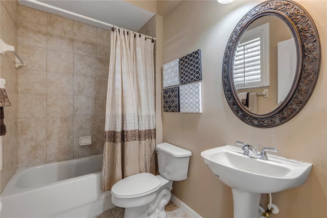 full bathroom featuring shower / tub combo with curtain, sink, tile patterned flooring, and toilet