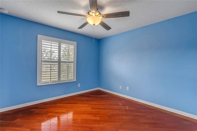 unfurnished room with hardwood / wood-style flooring, ceiling fan, and a textured ceiling