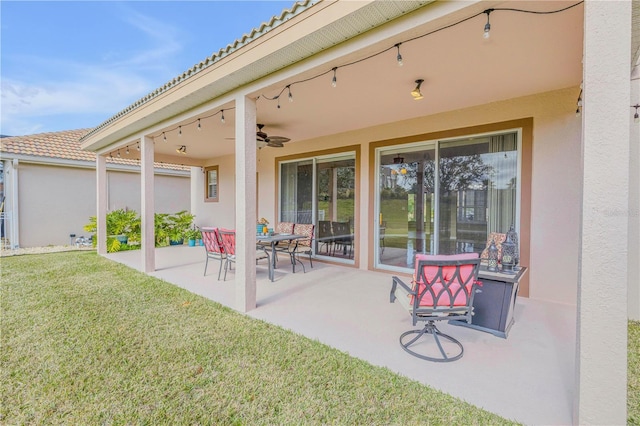 view of patio featuring ceiling fan