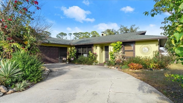 single story home featuring a garage