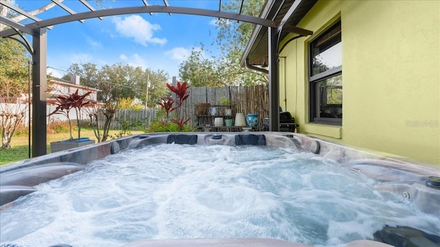 exterior space featuring a jacuzzi