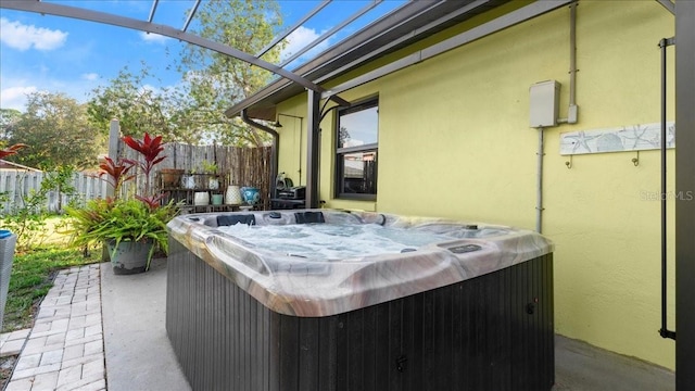 view of patio / terrace featuring a hot tub