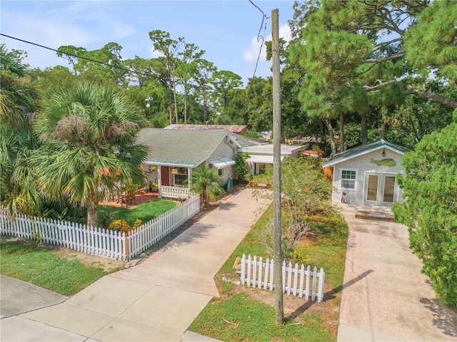 view of front of property featuring a fenced front yard and french doors