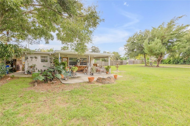 view of yard featuring a patio area and fence