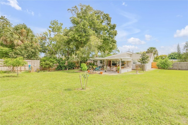 view of yard featuring a fenced backyard and a patio