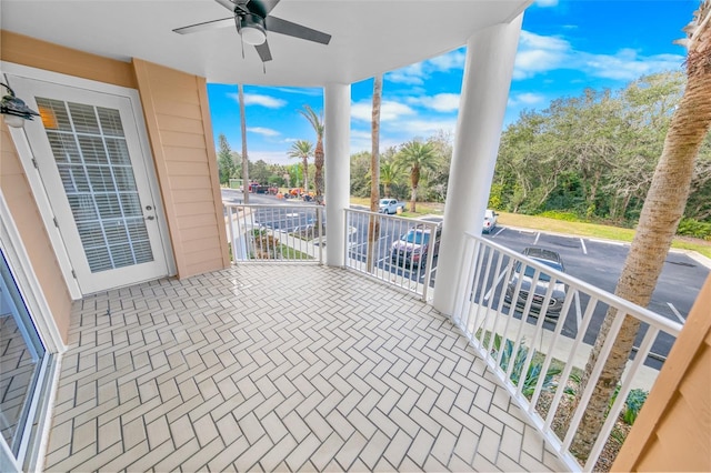 exterior space with ceiling fan