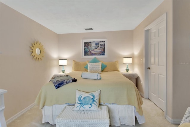 bedroom with light colored carpet