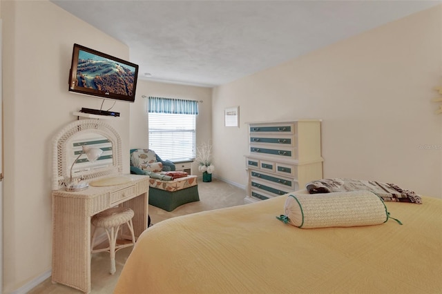 bedroom featuring light carpet