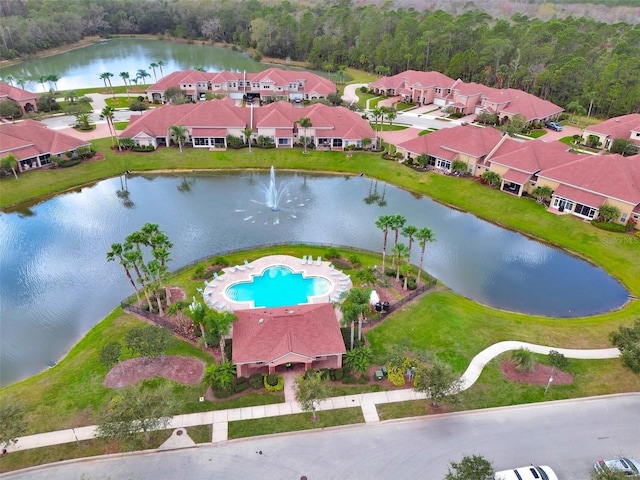 birds eye view of property with a water view