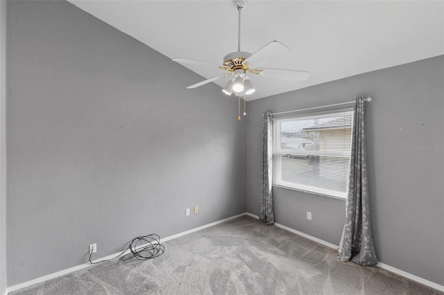 unfurnished room featuring ceiling fan, carpet, and baseboards